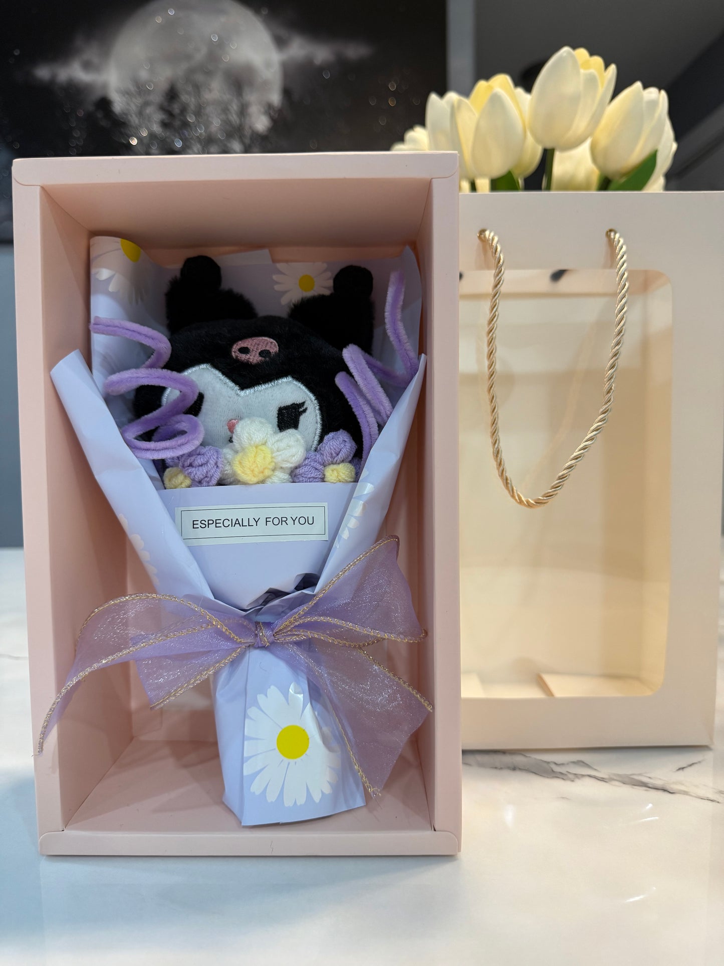 Mini bouquet of flowers with a plush toy.