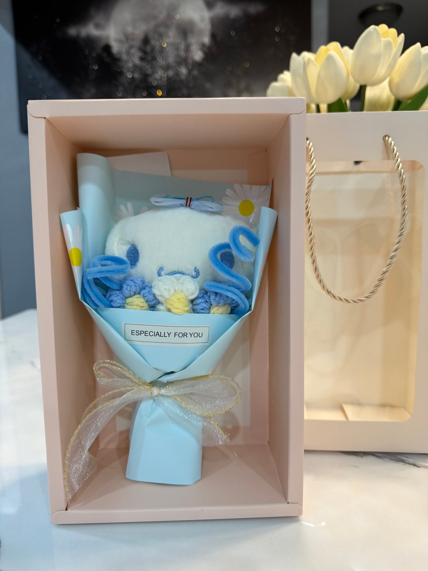 Mini bouquet of flowers with a plush toy.