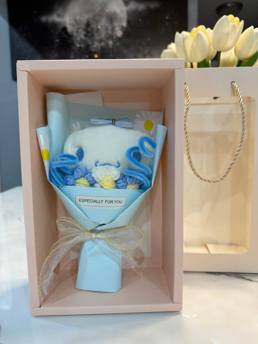 Mini bouquet of flowers with a plush toy.