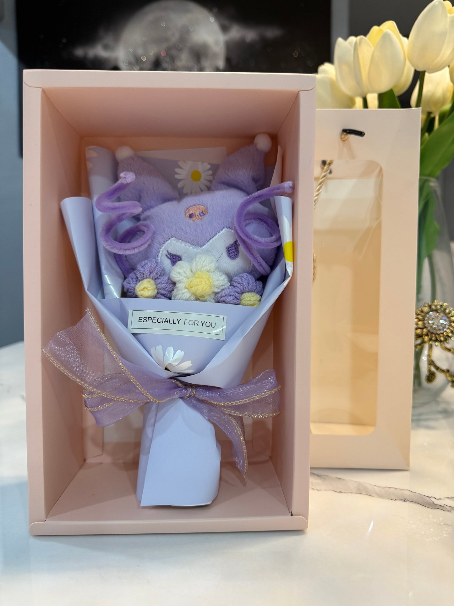 Mini bouquet of flowers with a plush toy.