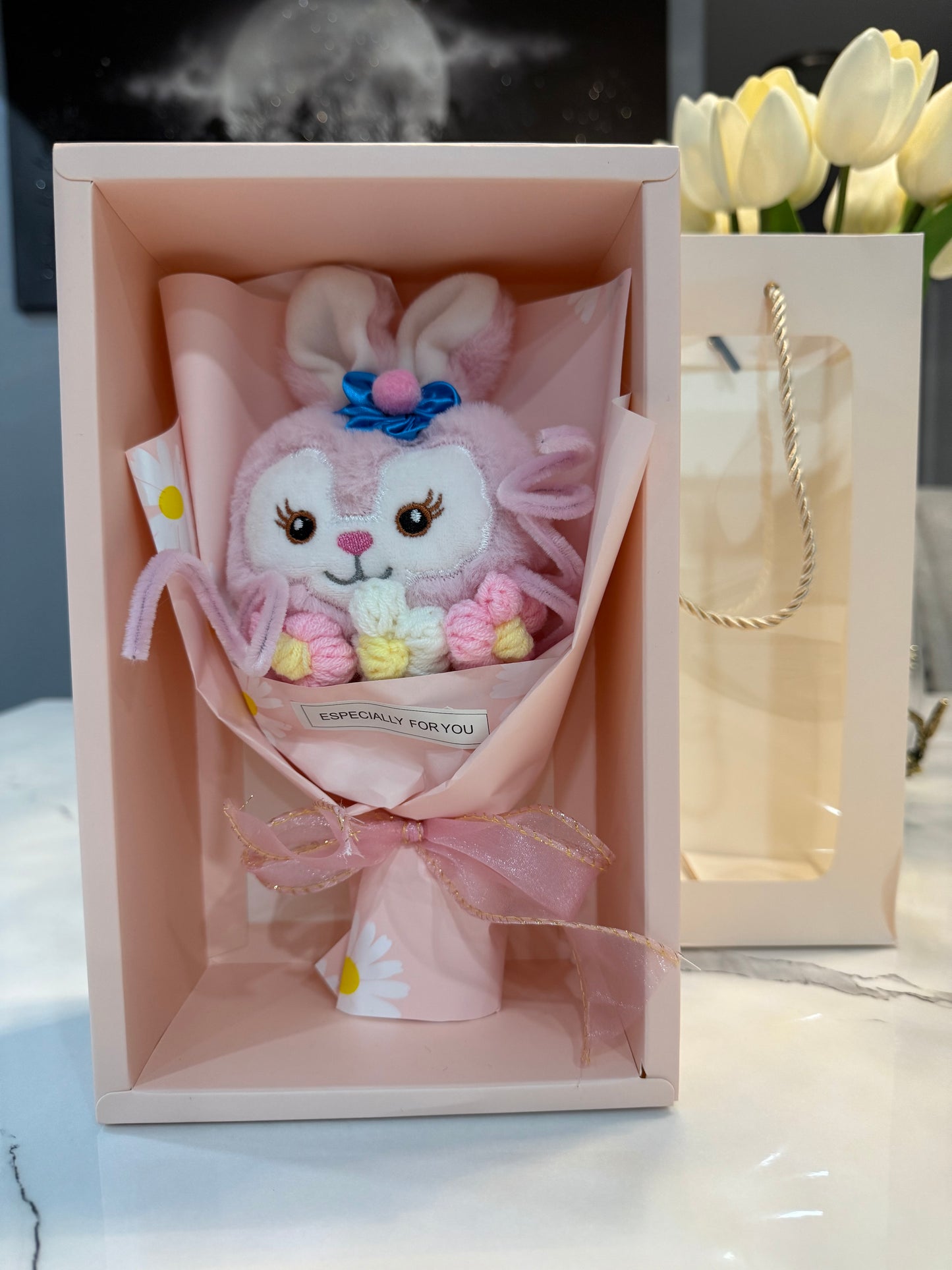 Mini bouquet of flowers with a plush toy.