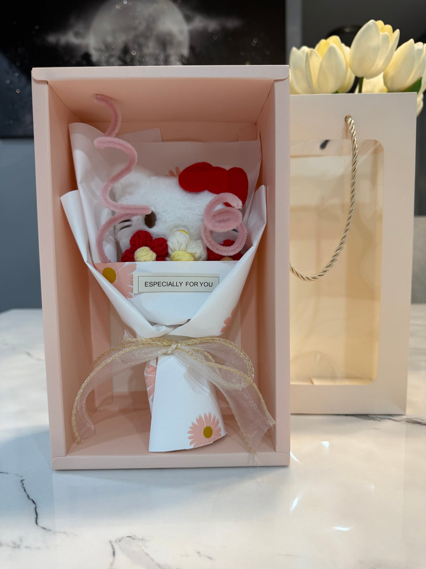 Mini bouquet of flowers with a plush toy.
